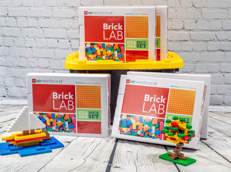 PCS Edventures BrickLAB boxes with brick builds of a boat and tree